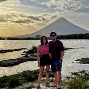 A couple standing in front of Volcano Concepcion in Ometepe