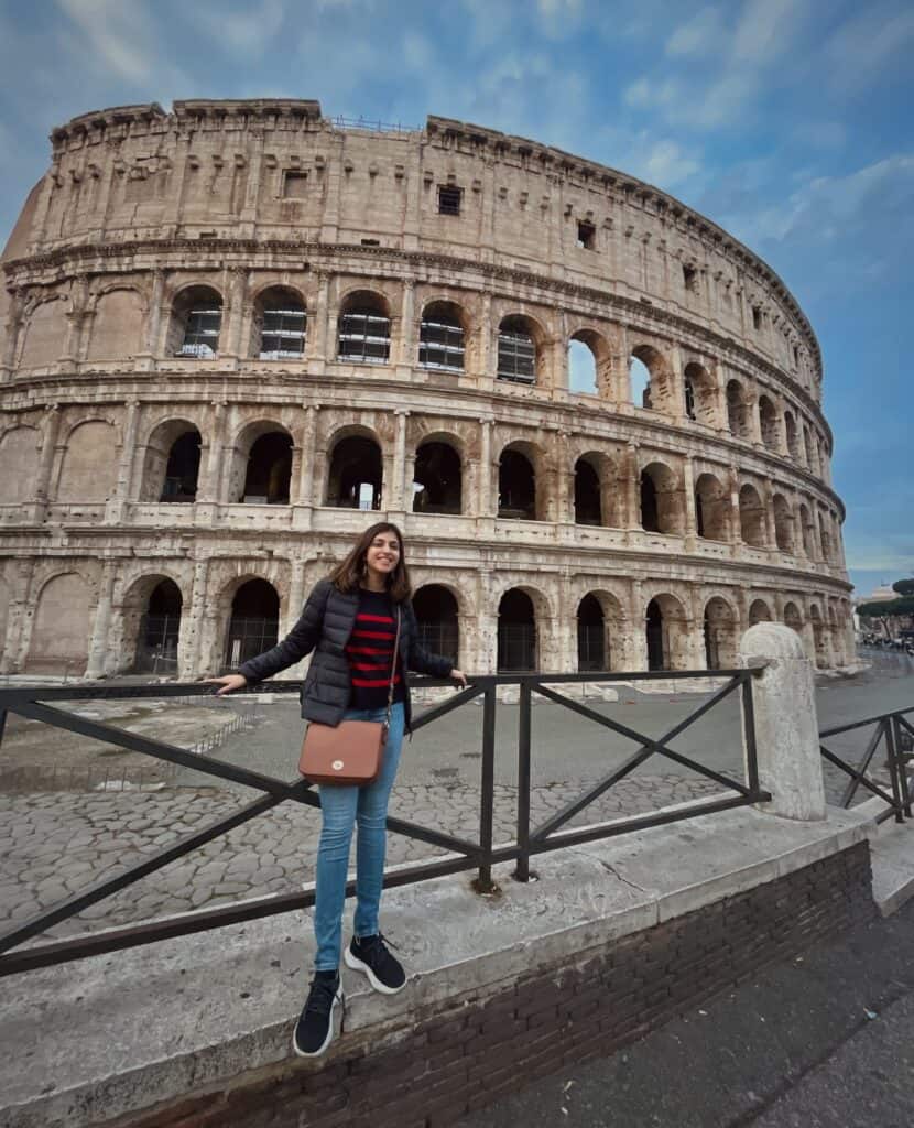 Person in front of Rome Colloseum