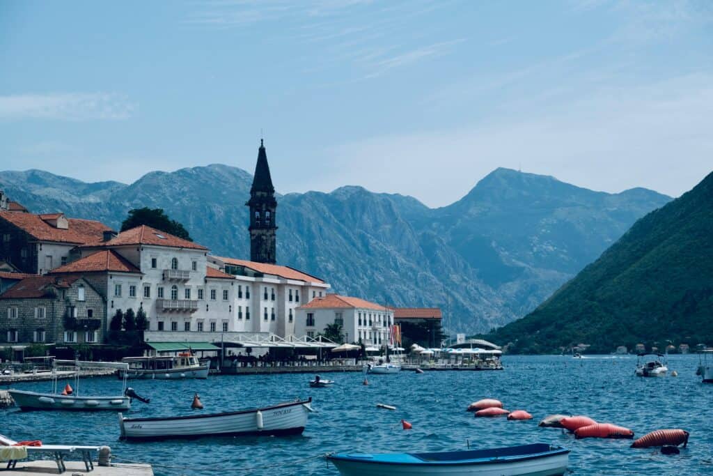 White concrete buildings of Kotor surrounded by water