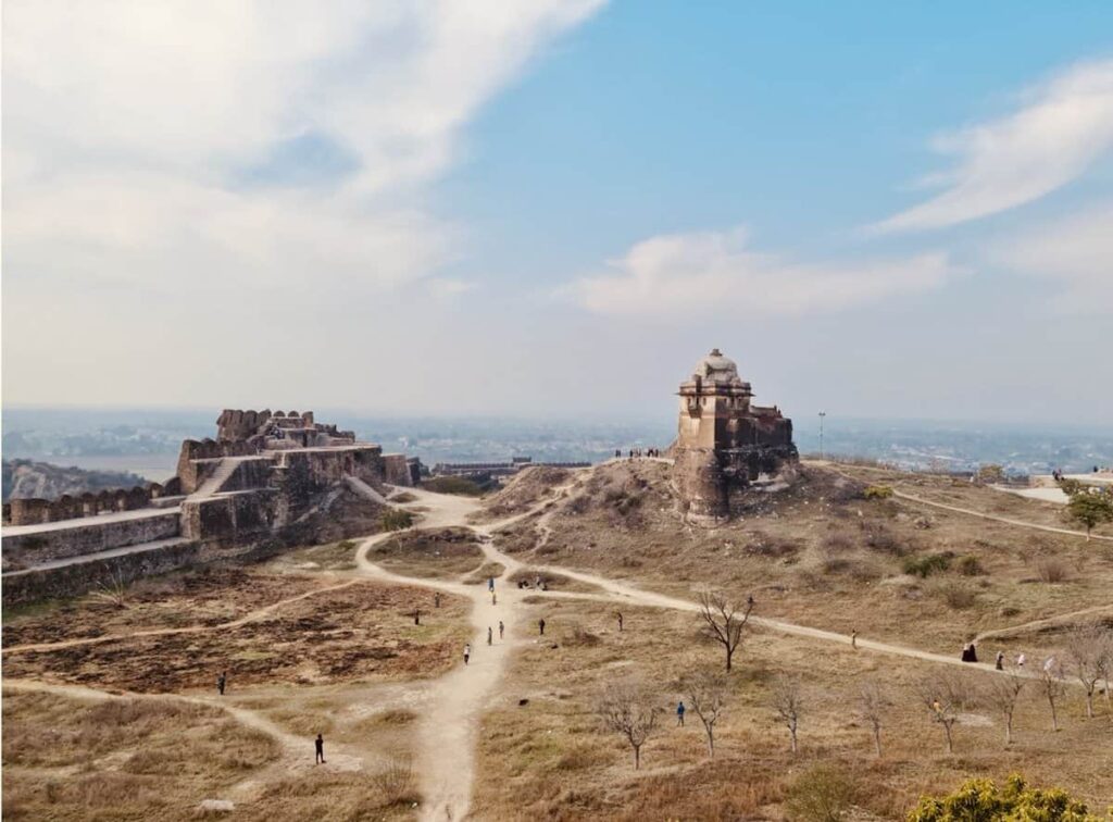 View of Rohtas Fort from far against a cloudy blue sky