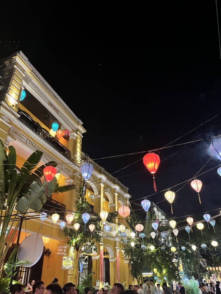 Lanterns hanging overhead on a narrow street