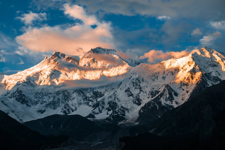 Captivating sunrise illuminating the snow-capped peaks of Nanga Parbat in Pakistan.