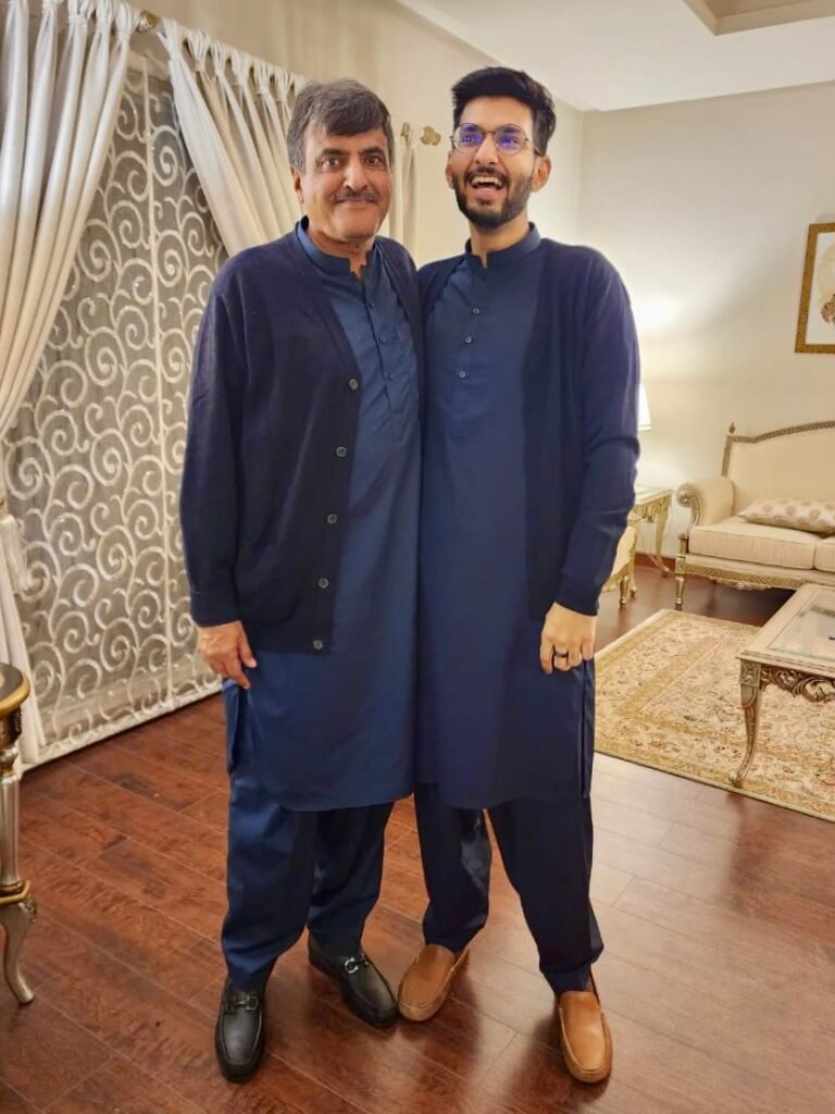 Two men wearing blue shalwar kurta (local Pakistani dress) on Eid.