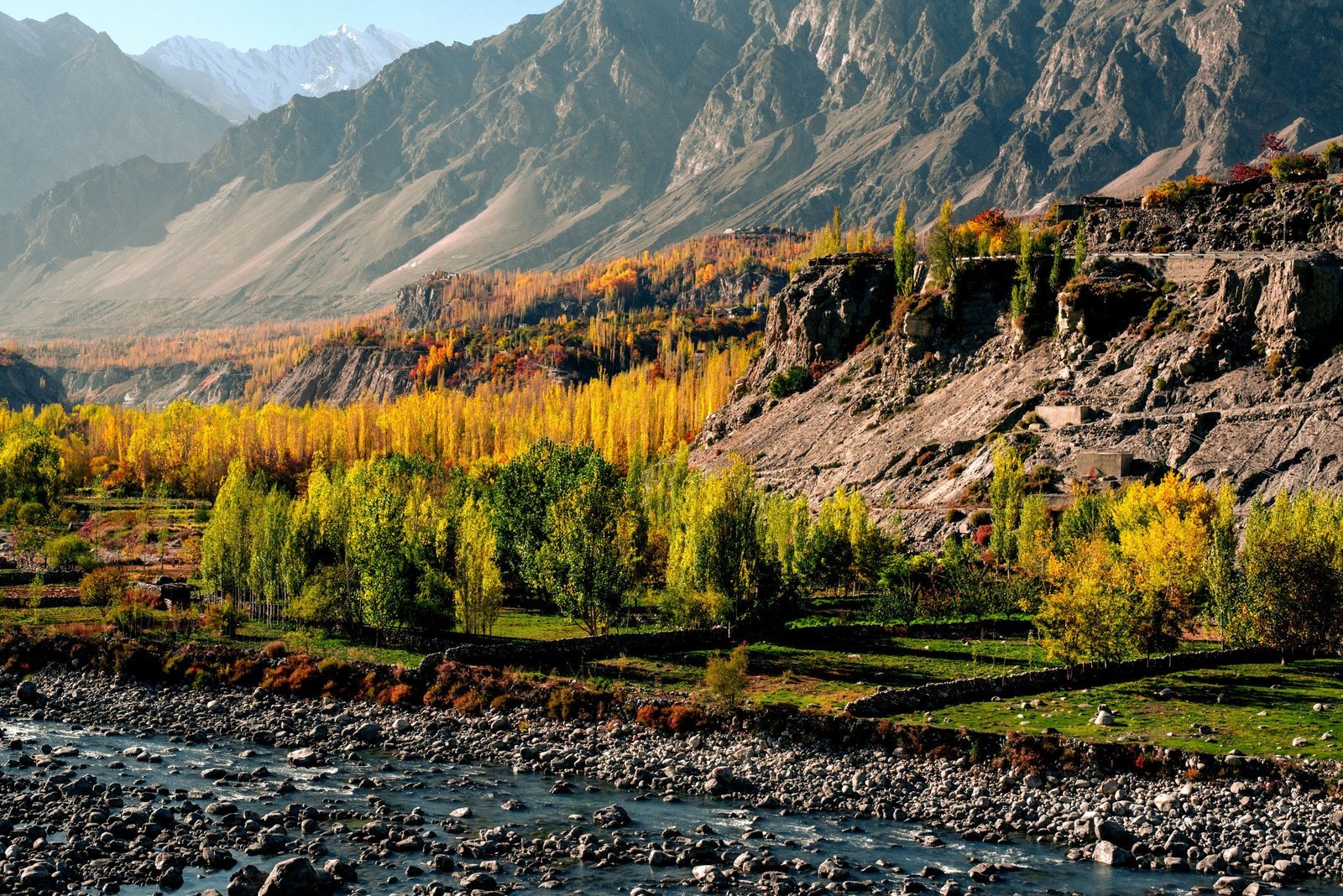 Beautiful autumn landscape of Hunza Nagar with rugged mountains and vibrant foliage.