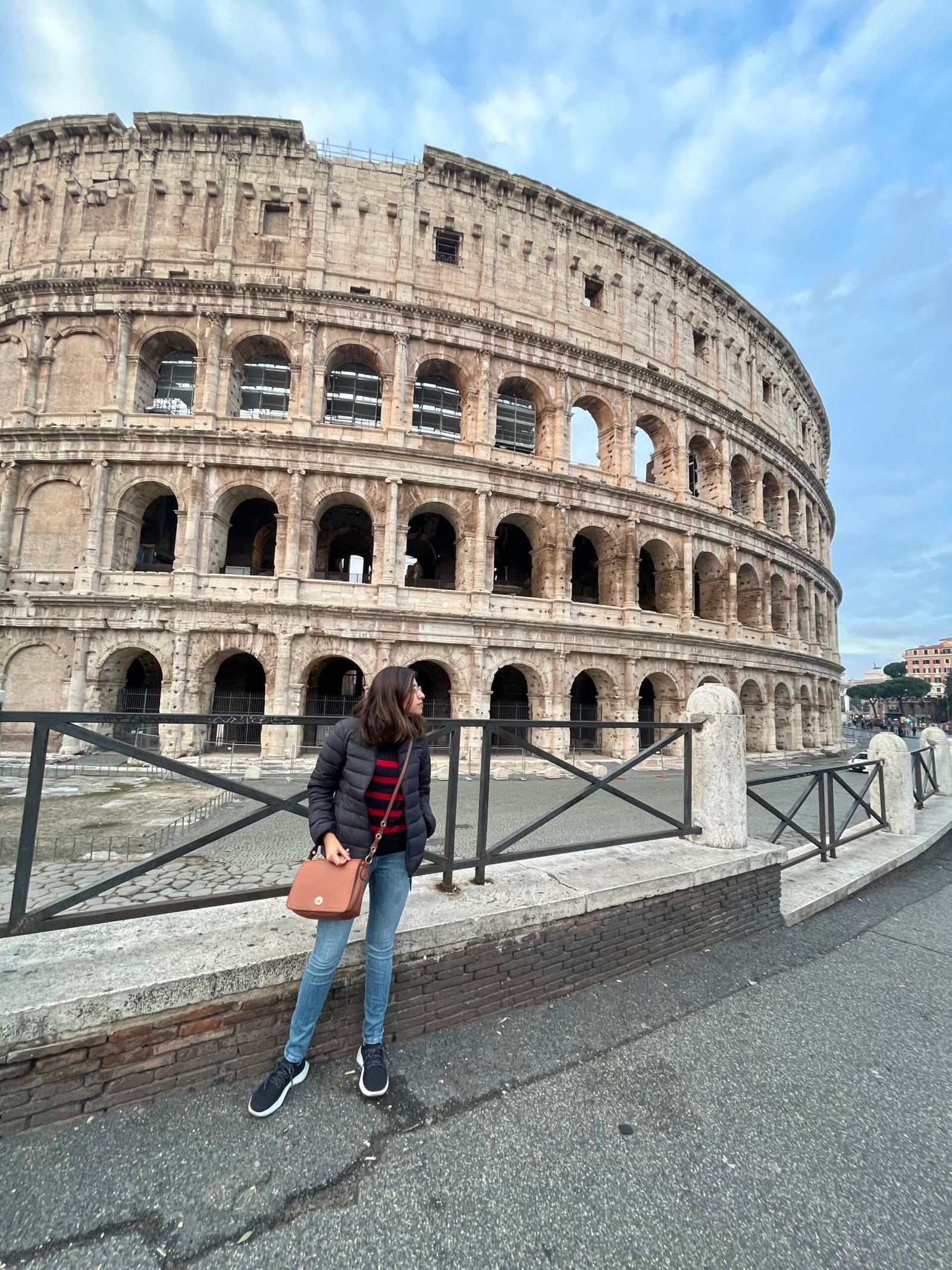 Me outside the Colosseum in the morning, a short walk downhill from Monti.