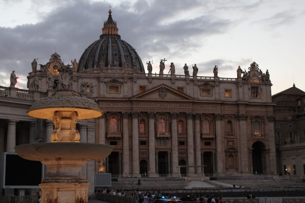 St Peter's Basilica at dusk from St Peter's Square, a short walk from the hotels in Prati.